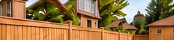 Wooden backyard fence beside a lawn